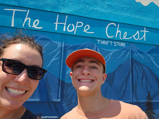 Amy and Jaxon smiling inside The Hope Chest thrift store in Red Bluff