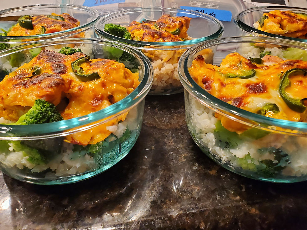 Meal prep glass containers filled with creamy chicken jalapeño bake and vegetables