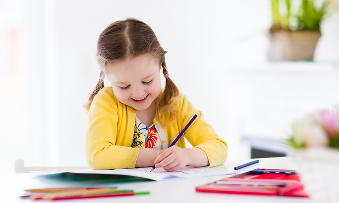 Cute little girl doing homework, reading a book, coloring pages, writing and painting. Chi