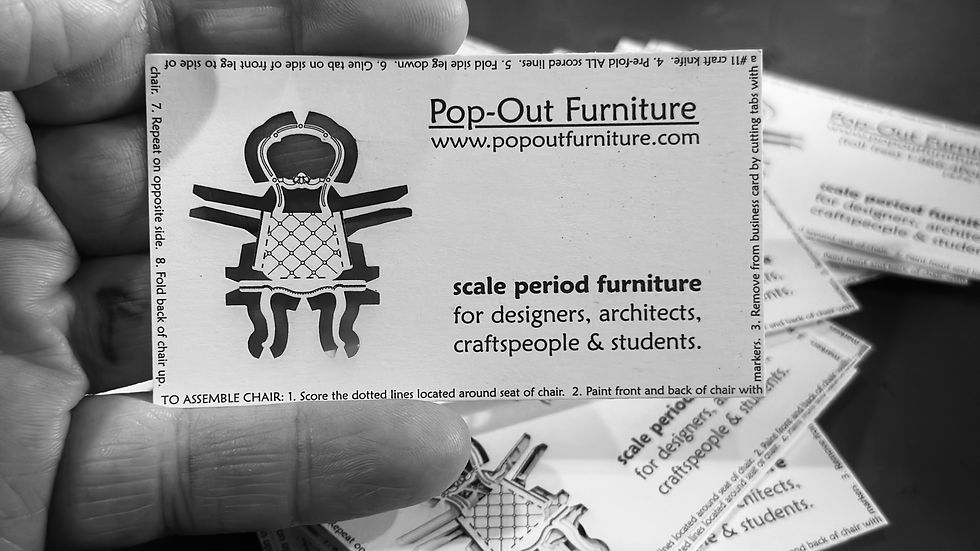 A business card with a chair in it