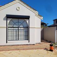 White house with arched window front

