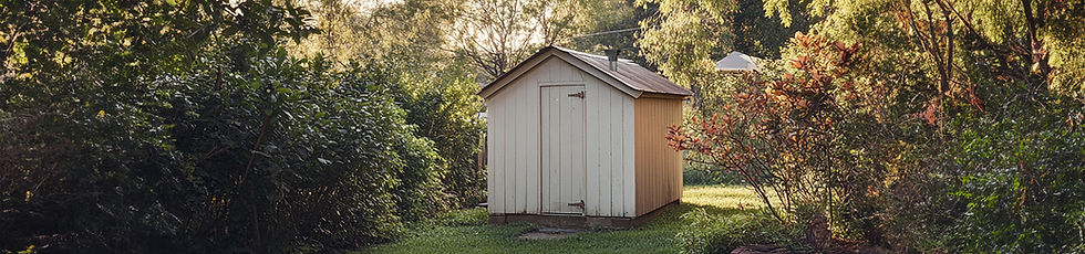 Backyard shed with a Johnny Hat solar powered fan installed