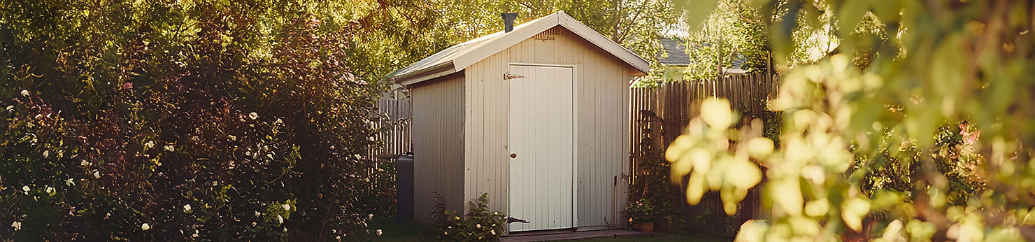 Small backyard shed with a Johnny Hat solar powered fan installed