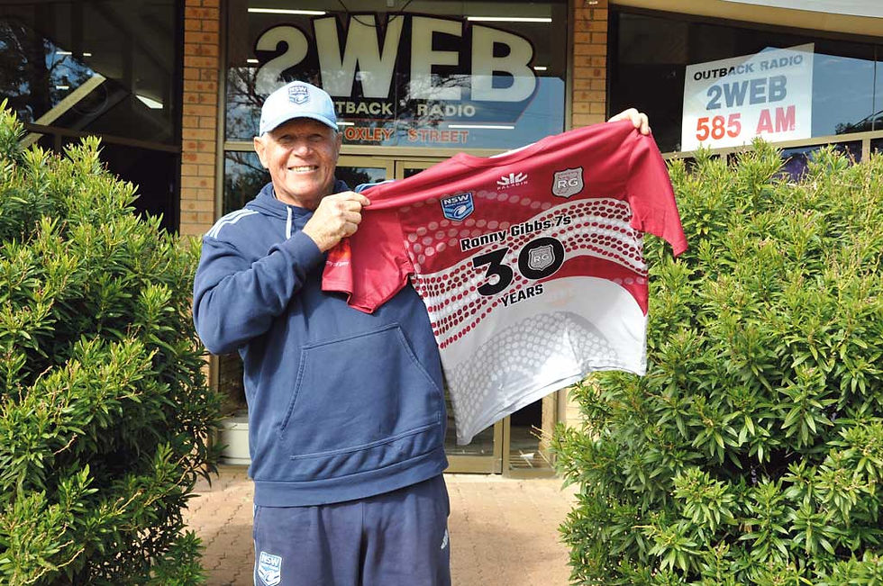 Ronnie Gibbs showing off the shirts for the 30 years celebration. Photo: Ian Cole