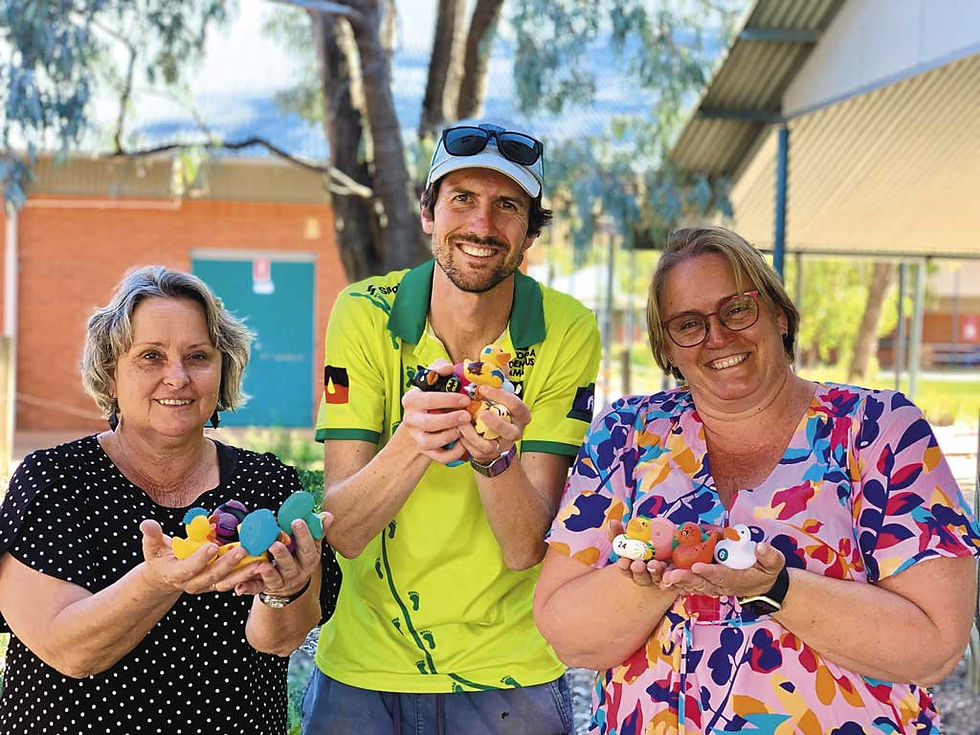 P&F members, Marg Morriss, Kurt Langmead and Charlotte Mallouk have their hands full with rubber ducks in the lead up to the school’s inaugural Duck Day. Photo: contributed