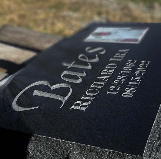 Jet black polished granite with engraving and porcelain photo