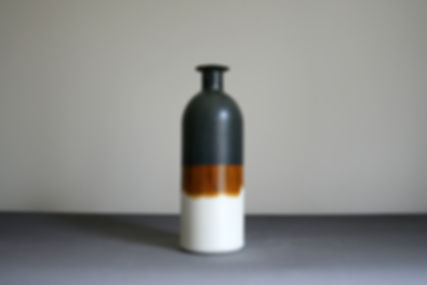 Brown bottle vase handmade by Rachel Leary Ceramics