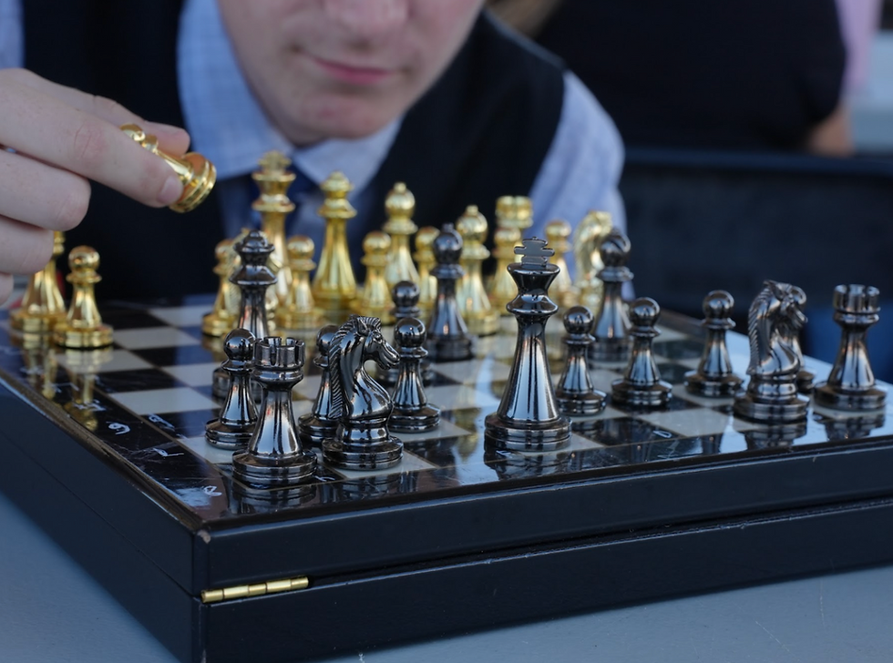 Huston McClure playing a game of Chess.