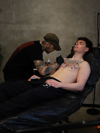 Freehand chest lettering tattoo design drawn directly on the client’s chest by Alex at Bad Habits Tattoo Karlsruhe