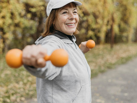 Woman walking outdoors or lifting light weights