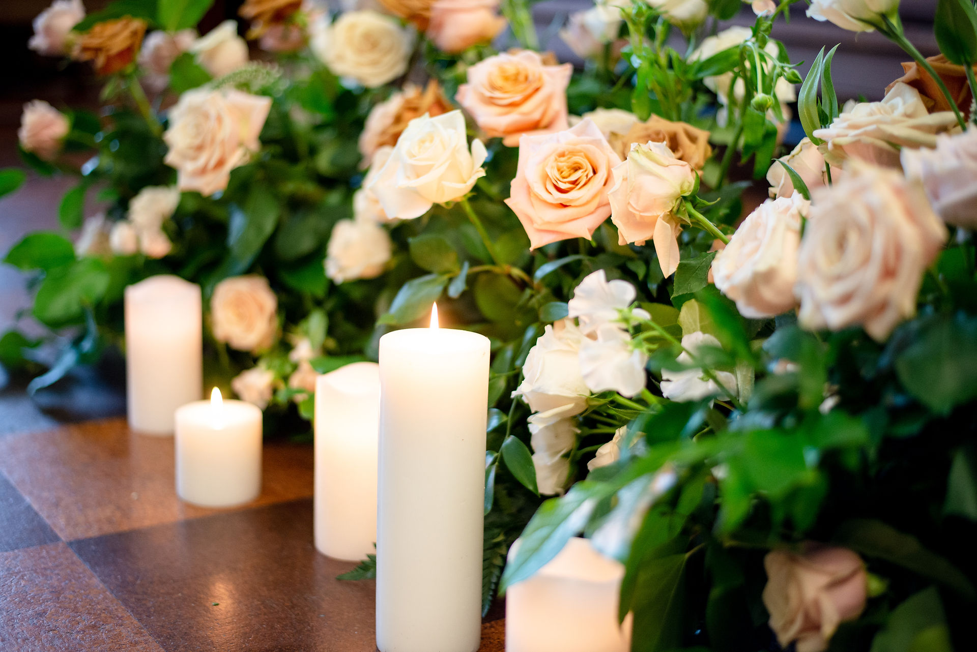 Wedding flowers and candles of Boho-Chic Wedding at Friends Meeting of Washington D.C. by dc wedding planner