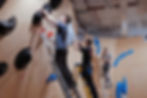 Eye-level view of a climbing wall with various holds