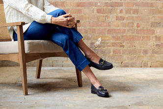 Close up of leather loafer with denim and white shirt styling for SS25
