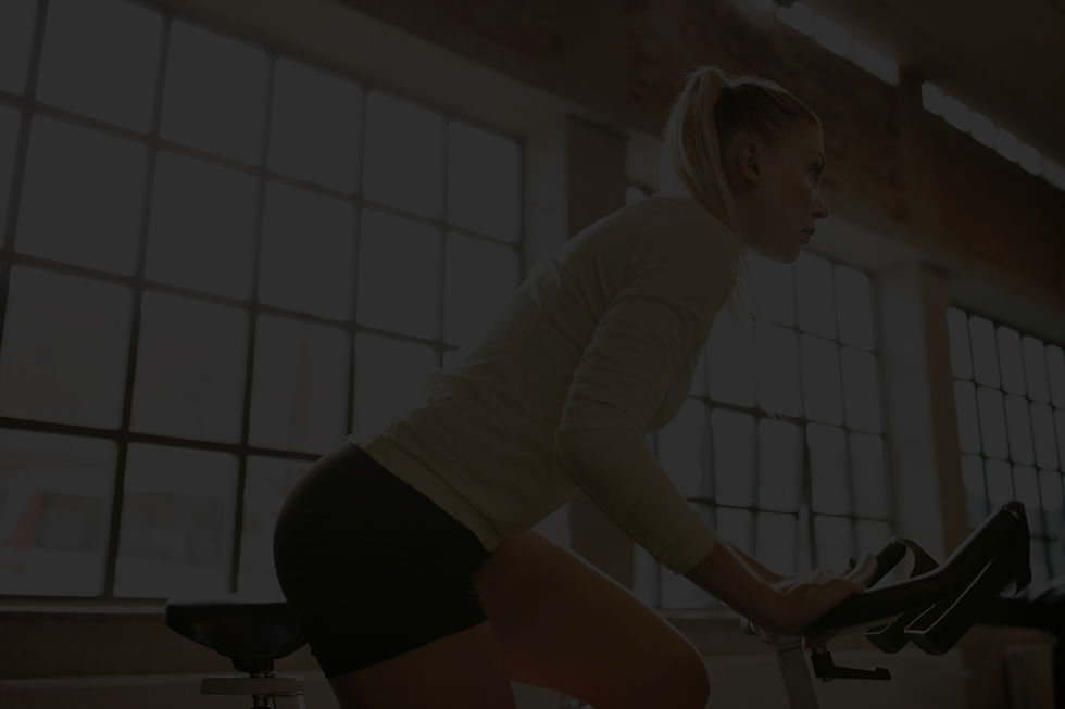 woman-working-out-on-a-stationary-bike-2024-09-22-22-52-09-utc.jpg