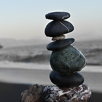 hormone rebalance illustarted by a picture of rocks balancing