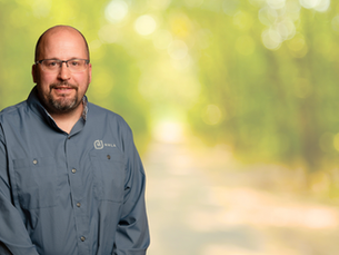 image of nhla national inspector marty westeen over blurred forest background