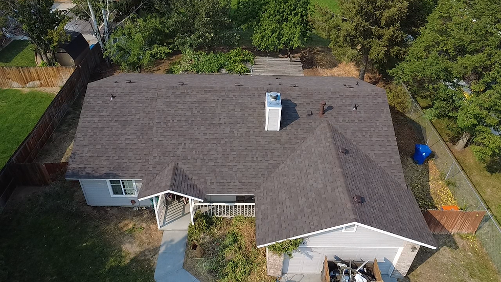 This image shows a recently replaced roof through Hilltop Roofing with Malarkey Shingles.