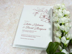 Close-up of Blush Roses wedding invitation showing abstract floral design