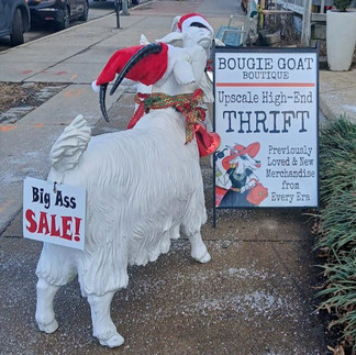 thrift store sign with goat