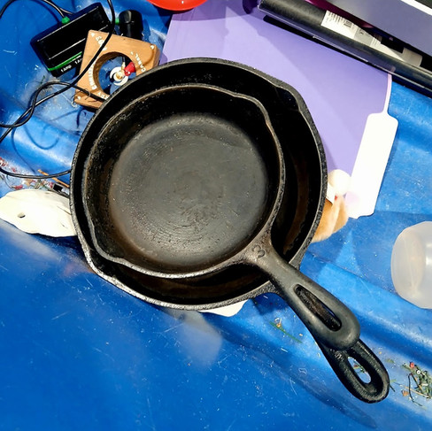 cast iron pans at the goodwill bins