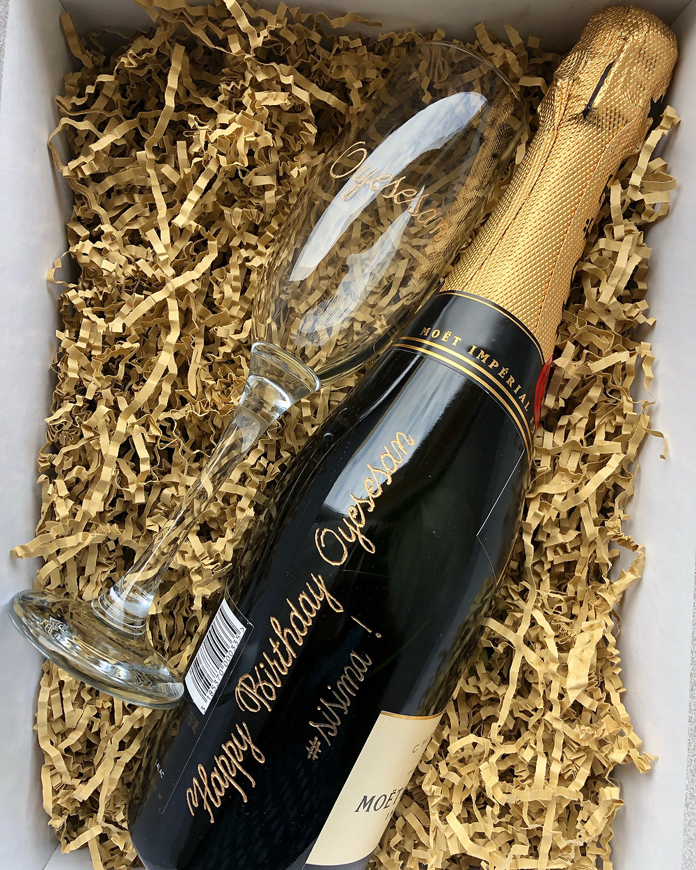 Champagne bottle hand-engraved through my teaching her online.
