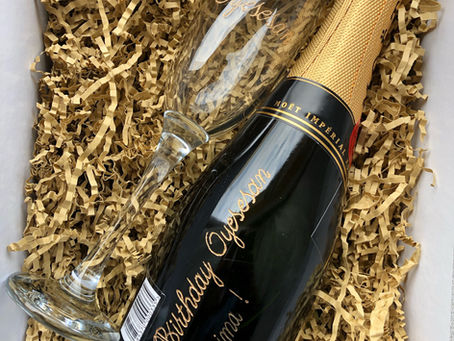 NIGERIAN WOMAN ENHANCES HER GIFT BASKET BUSINESS WITH ENGRAVED BOTTLES OF WINE AND CHAMPAGNE. 