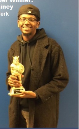 Smiling man holding award, text reads: Rodney Whitney, WORK, celebration event