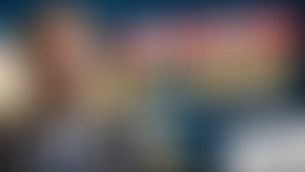 Man in suit with concerned look, text "Poor Credit? Get Funded! Business Loan Secrets," loan document, money stacks, credit score 520.