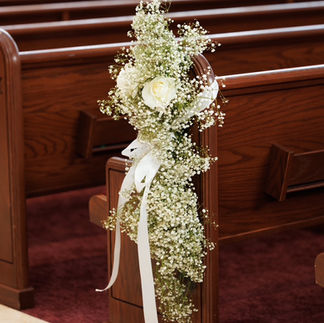 Wedding Ceremony Classic White with babies breath at church with pew decorations by Floriography Designs NJ