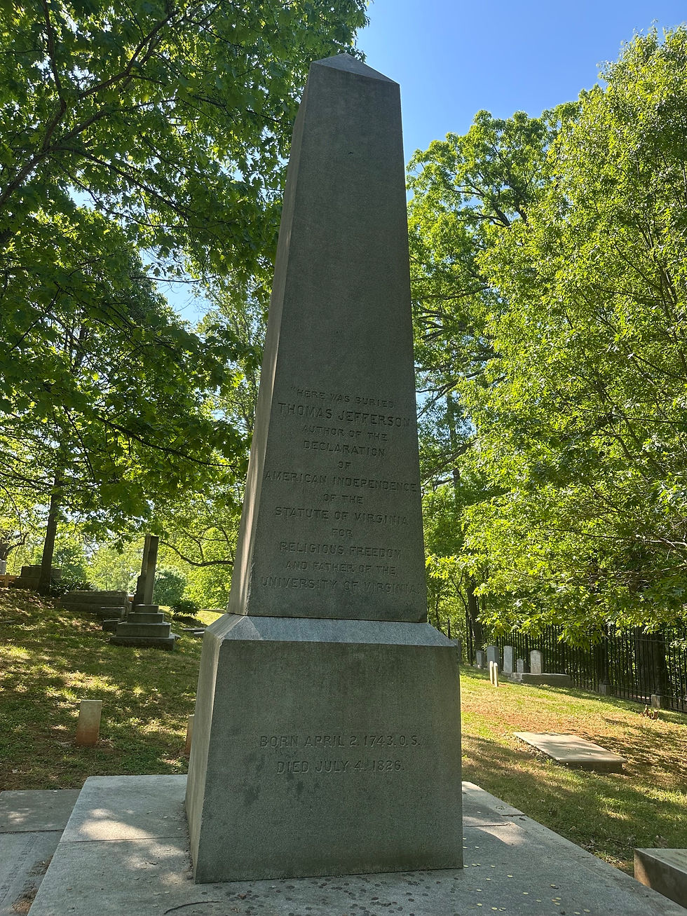 Thomas Jefferson's grave, nickels surround the foot of it, placed there by patrons in homage to him and his life.