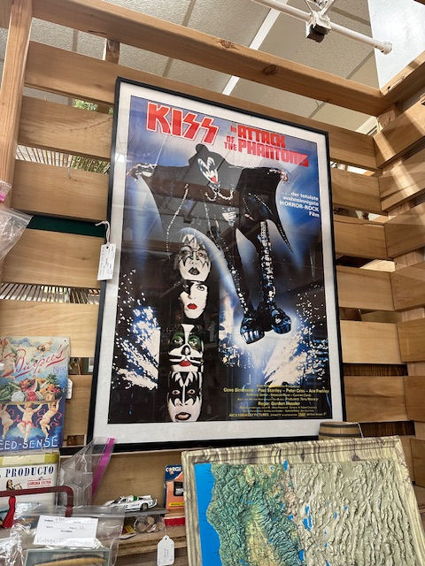 A very large framed poster of the band KISS, as promo for 'Attack of the Phantoms'.