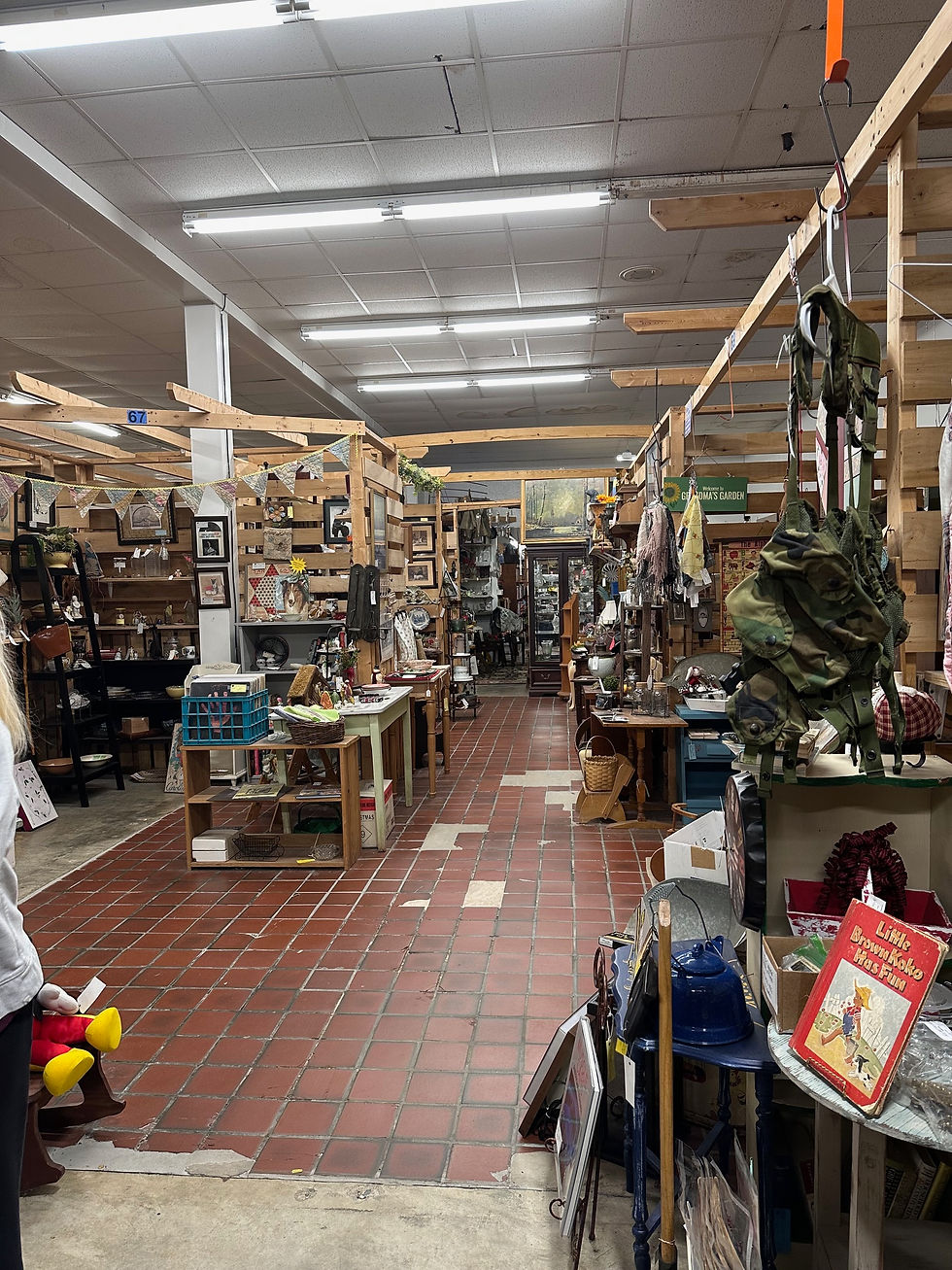An aisle in the Blue Horseshoe where you can see different booths and branching pathways.
