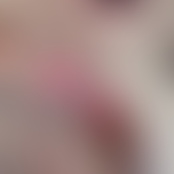 Hook pulling the working yarn through to form the first loop of the magic ring.