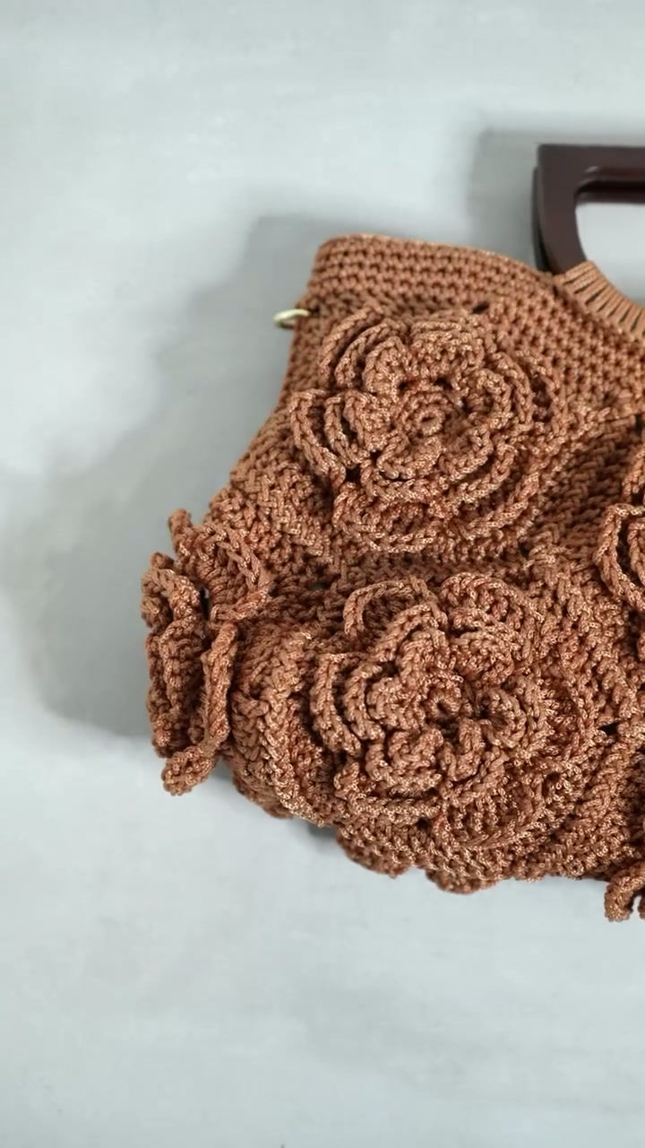 Thumbnail: Floral Flare Caramel Beige crochet bag shown in motion, highlighting handmade floral design, wooden handles and gold details