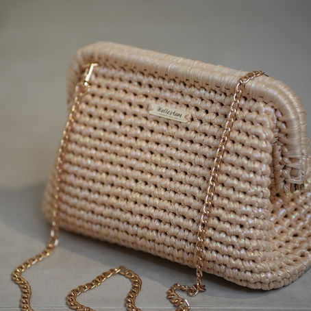 Beige Celeste Clutch with gold details — a handmade Hallestam bag showcasing true artisan quality.