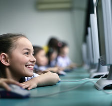 EYFS students using a computer