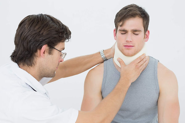 male-doctor-examining-patients-neck (1).jpg