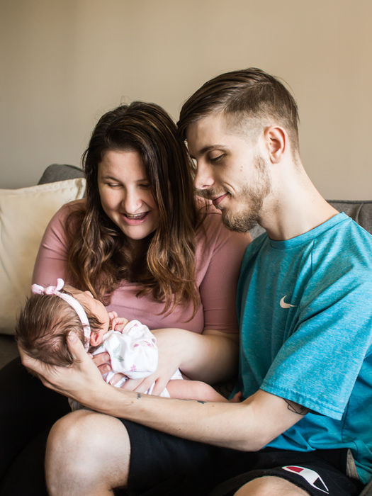 Newborn photography session with soft neutral tones and cozy indoor setting northern Kentucky