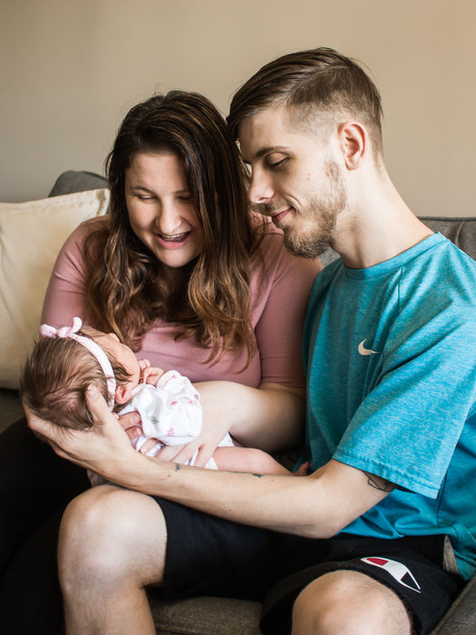 parents holding their newborn baby in southeast  indiana