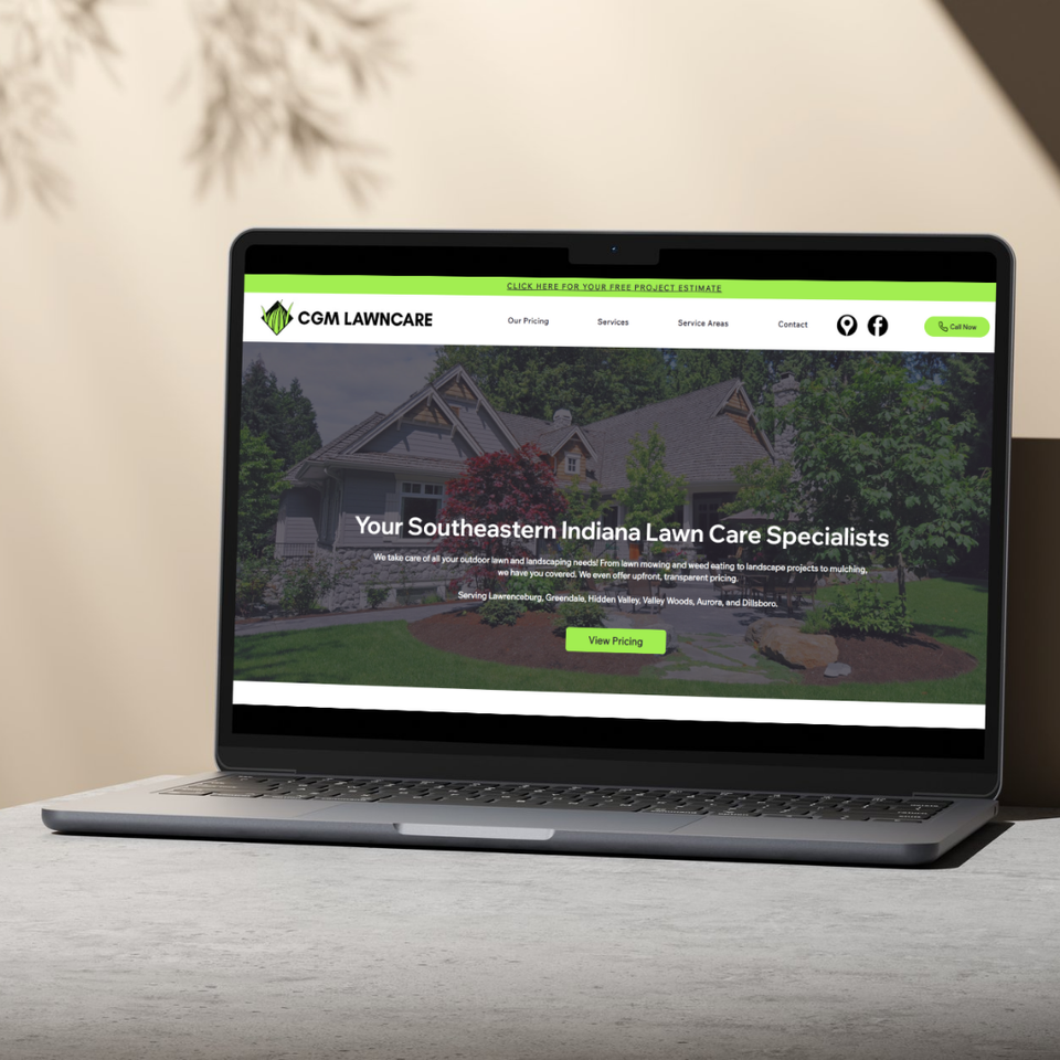 Photo of the CGM Lawncare website on a laptop.