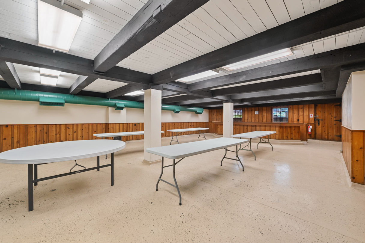 Party hall with a dining area.