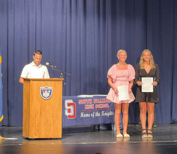 Students poses for photos as they receives South Dearborn Dollars for Scholars Scholarship