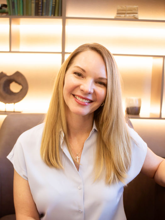 Close-up of smiling woman in office setting, branding and headshot photography in Cincinnati Ohio