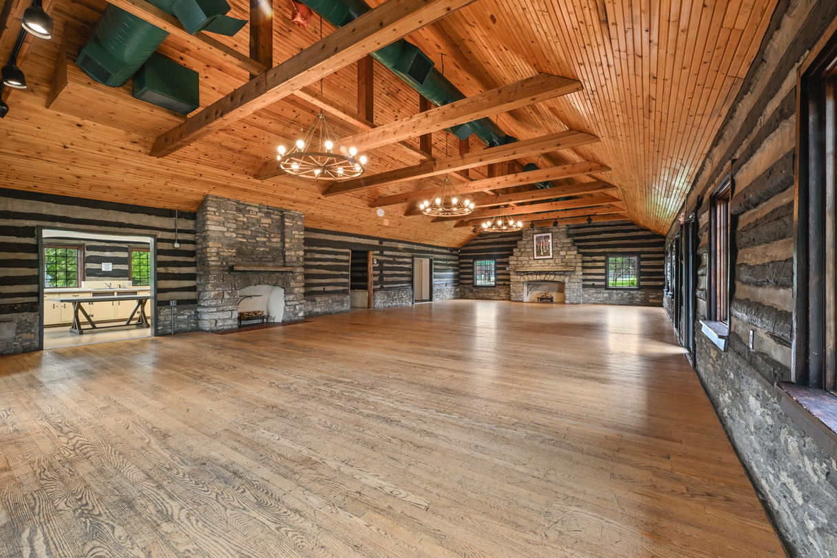 Spacious view of the rustic interior on the upper floor of Greendale Cabins.