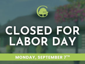 Green sign over blurred outdoor background reads CLOSED FOR LABOR DAY, MONDAY, SEPTEMBER 7TH