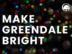 Text "MAKE GREENDALE BRIGHT" over colorful blurred lights in a dark background. Circular tree logo in the top right corner. Festive mood.