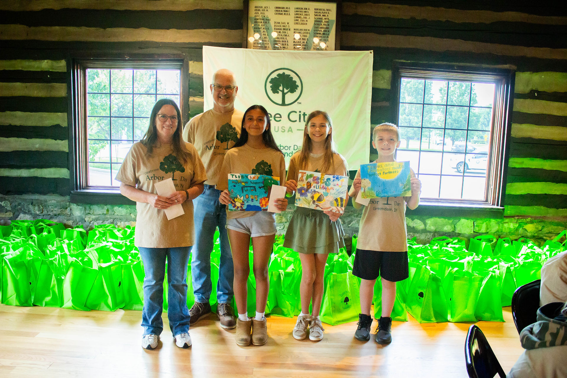 Fifth-Grade CES students stand with Mayor Vince Karsteter with their Arbor Day Posters
