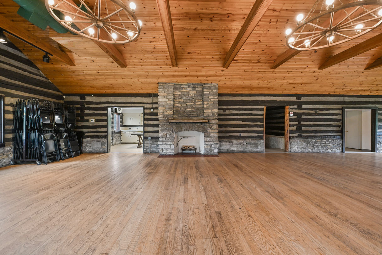 Upper level showing beautiful chandeliers and fireplace.