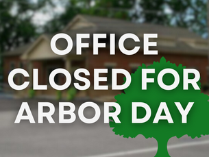 Text "Office Closed for Arbor Day" over a blurred building background with a green tree graphic.