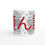 Thumbnail: Tsundoku Mug design written in red colour in Japanese with pile of books and flowers on a white background from the middle view.